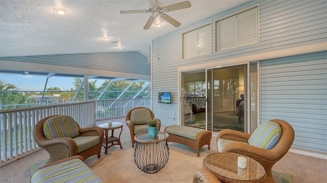 sunroom with lofted ceiling and ceiling fan