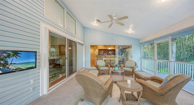 sunroom / solarium with lofted ceiling and ceiling fan