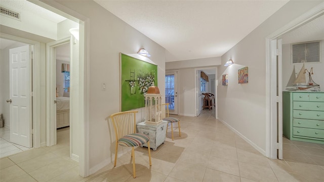 hallway with light tile floors