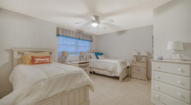 tiled bedroom featuring ceiling fan and a textured ceiling