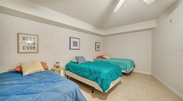 bedroom with a textured ceiling, ceiling fan, and light tile floors