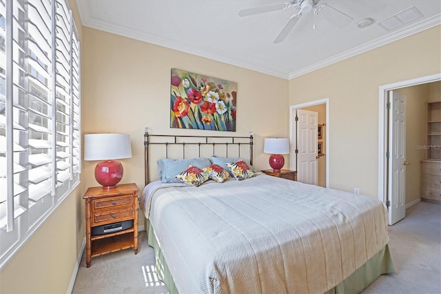 bedroom with crown molding, light colored carpet, and ceiling fan