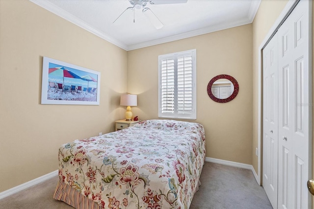 bedroom featuring crown molding, light colored carpet, and a closet