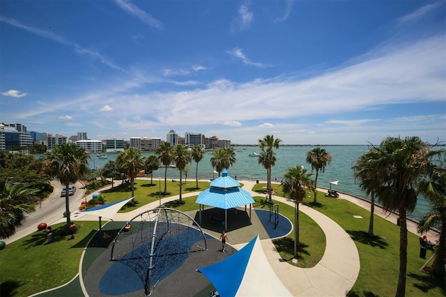 view of community featuring a gazebo, a water view, and a yard