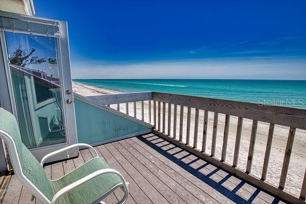 exterior space with a beach view and a water view