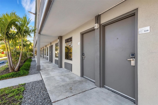 doorway to property with a patio