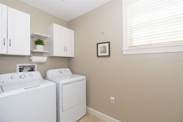 washroom with independent washer and dryer, hookup for a washing machine, cabinets, and light tile floors