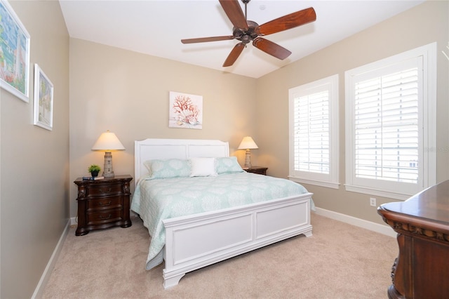 bedroom featuring light carpet and ceiling fan