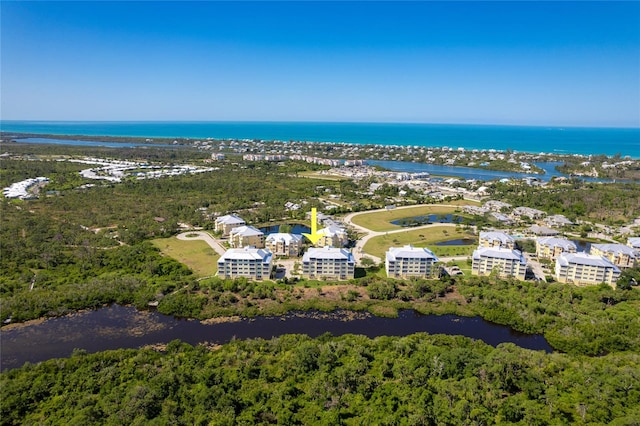 drone / aerial view with a water view