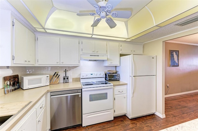 kitchen featuring dark wood-type flooring, ornamental molding, white cabinets, white appliances, and ceiling fan