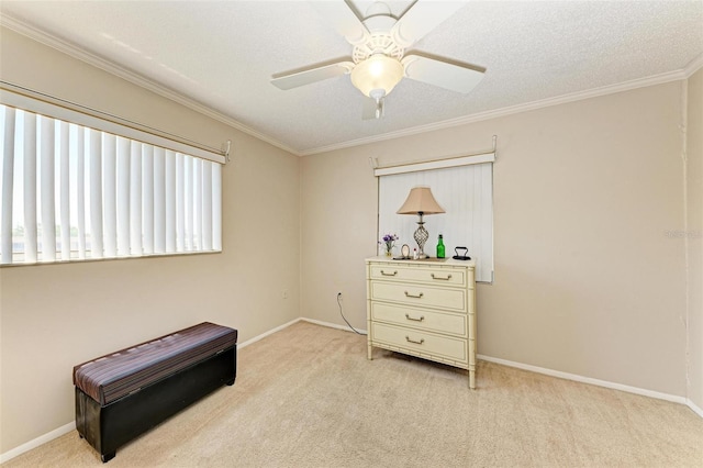 sitting room with ornamental molding, light carpet, a textured ceiling, and ceiling fan