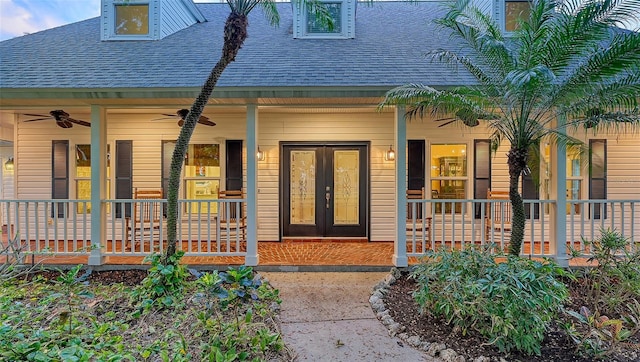 property entrance with french doors, ceiling fan, and a porch