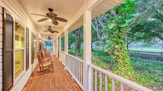 balcony with ceiling fan and covered porch