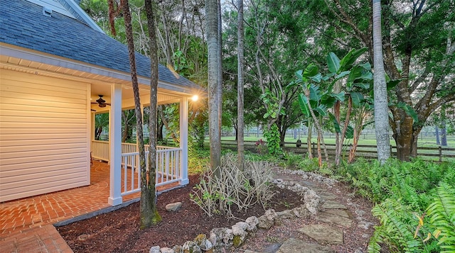 view of yard featuring ceiling fan