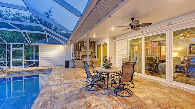 view of patio with ceiling fan and a lanai