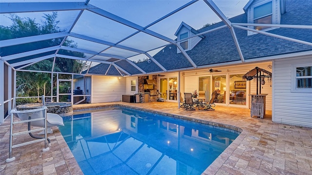 view of pool featuring a patio area, ceiling fan, and a lanai