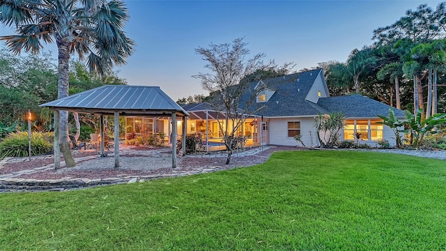 view of front of house with a yard