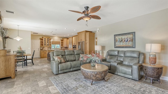 living room featuring ceiling fan and light tile floors