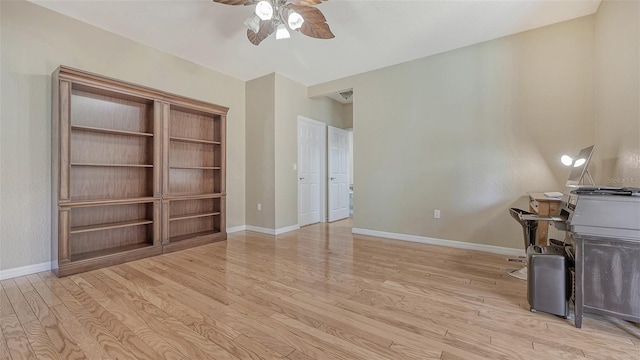 unfurnished office featuring light hardwood / wood-style flooring and ceiling fan