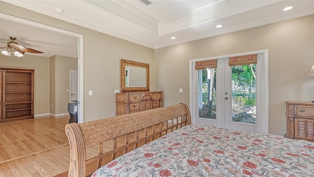 bedroom with ceiling fan, light wood-type flooring, access to exterior, crown molding, and french doors