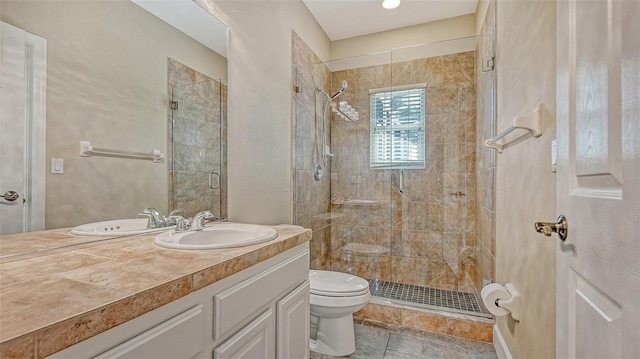 bathroom featuring tile flooring, an enclosed shower, toilet, and large vanity