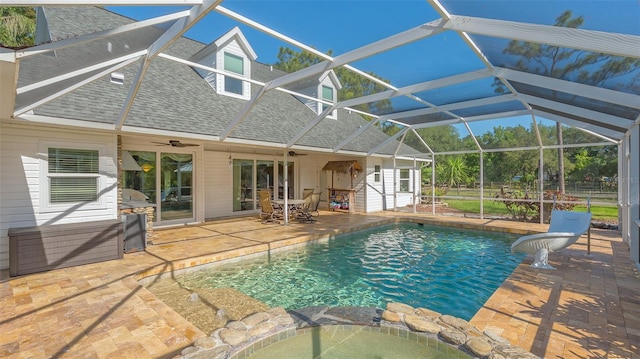 view of pool featuring ceiling fan, a lanai, and a patio