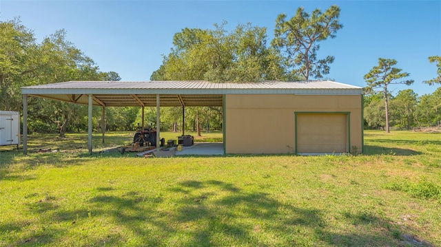 garage featuring a lawn