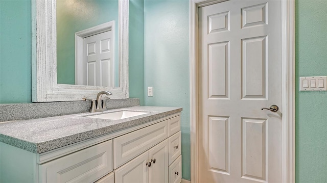 bathroom featuring vanity with extensive cabinet space