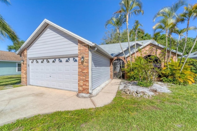 view of home's exterior with a garage and a lawn