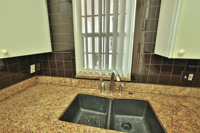 kitchen with decorative backsplash and sink