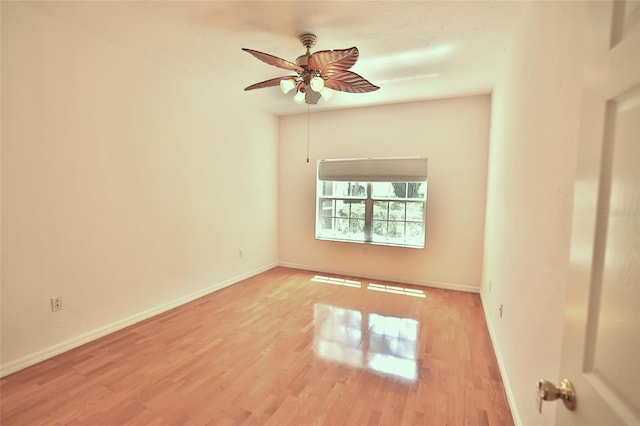 unfurnished room with light wood-type flooring and ceiling fan