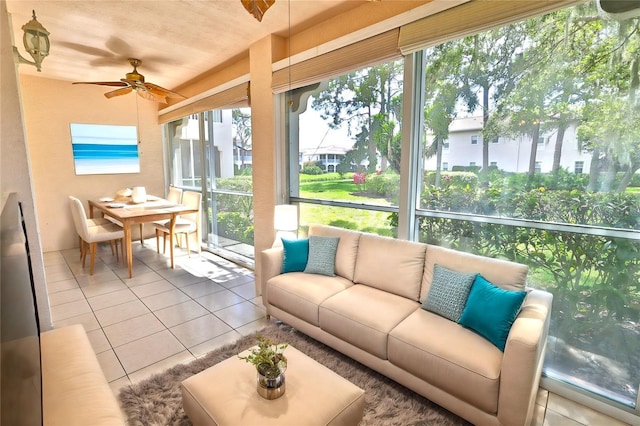 sunroom / solarium featuring ceiling fan