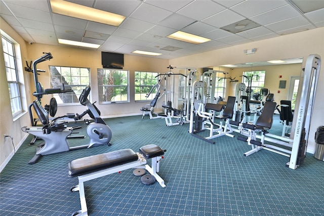 workout area featuring a paneled ceiling