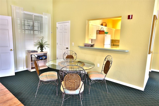 view of carpeted dining room