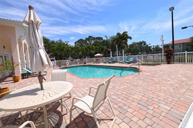 view of swimming pool featuring a patio