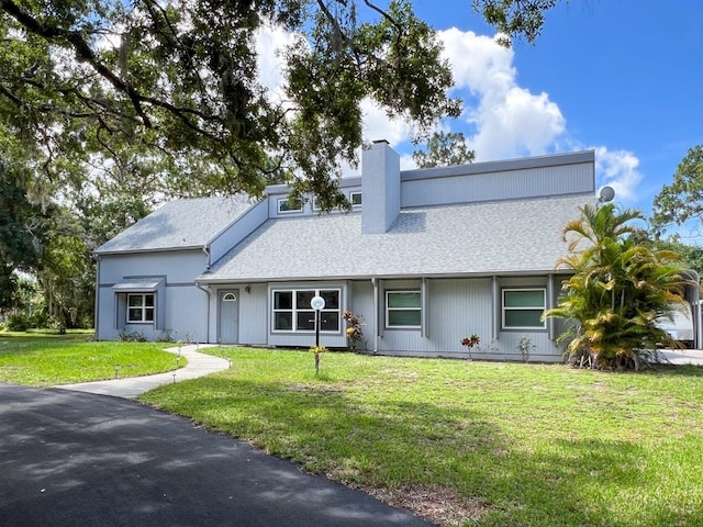 view of front of home with a front yard