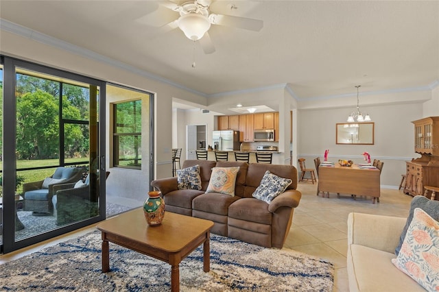 tiled living room featuring ceiling fan with notable chandelier and ornamental molding