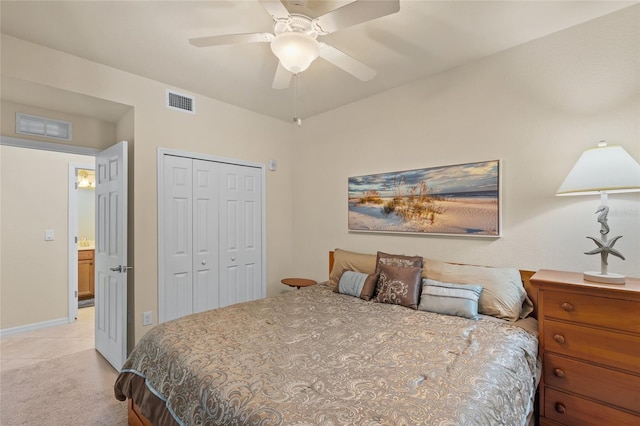 carpeted bedroom featuring ceiling fan and a closet