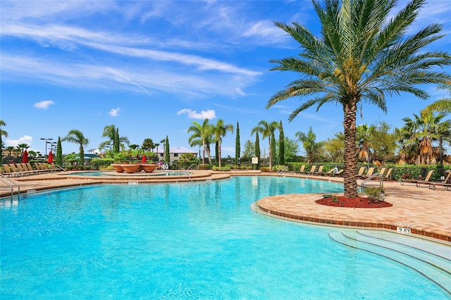 view of swimming pool featuring a patio