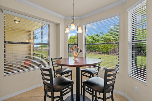 tiled dining area featuring a notable chandelier and ornamental molding