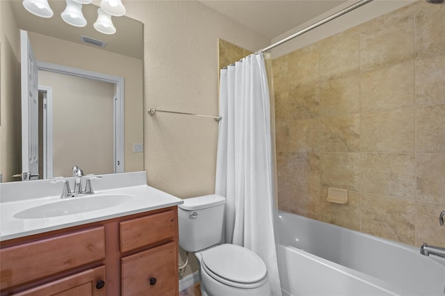 full bathroom featuring shower / bath combination with curtain, toilet, and vanity