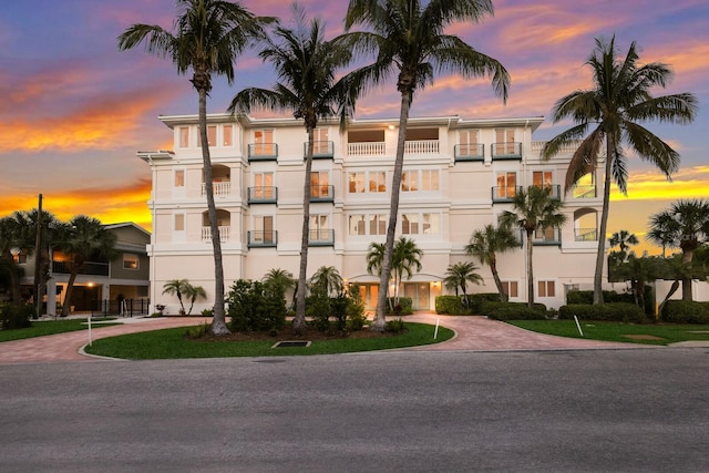 view of outdoor building at dusk