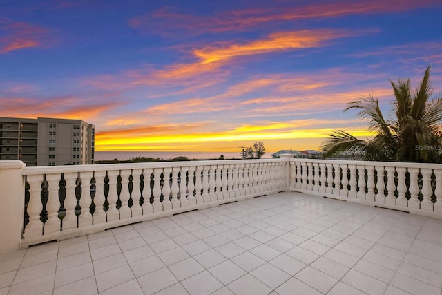 patio terrace at dusk with a balcony