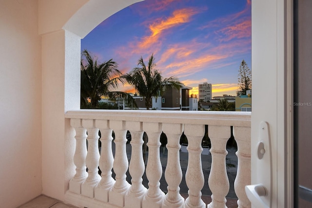 view of balcony at dusk