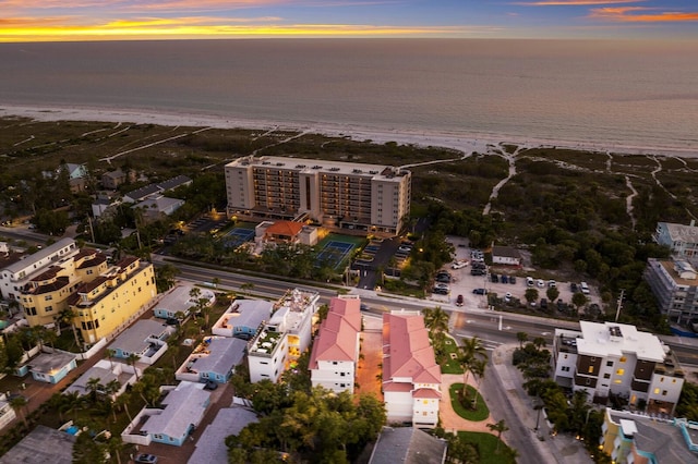 aerial view at dusk with a water view