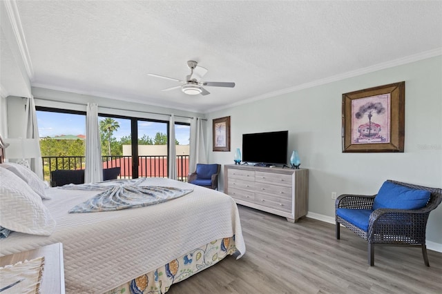 bedroom featuring hardwood / wood-style floors, ceiling fan, access to outside, and ornamental molding