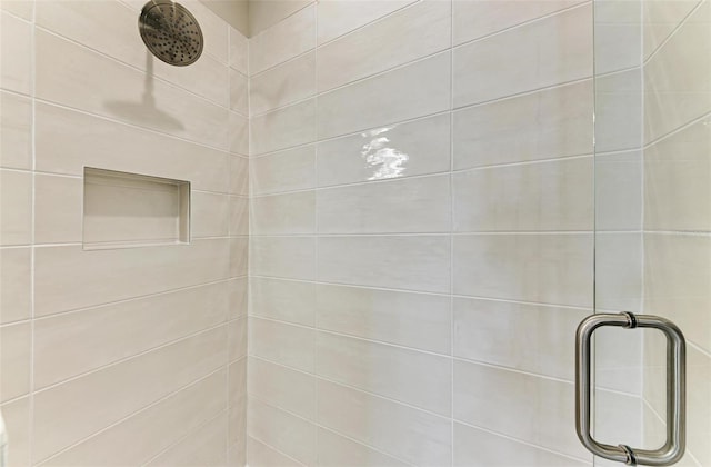 room details with a tile shower