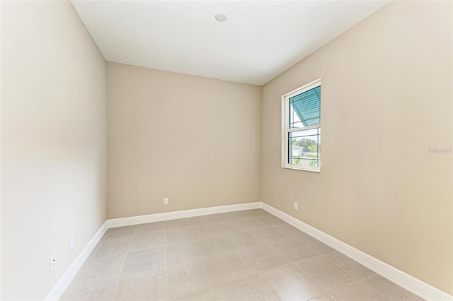 empty room with light tile floors