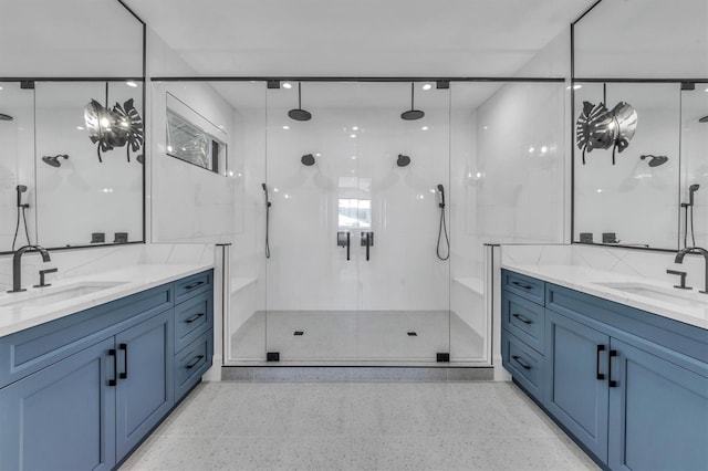 bathroom with decorative backsplash, a shower with door, and vanity