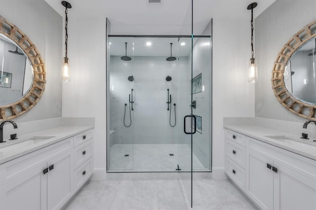 bathroom with vanity, tile patterned floors, and a shower with door